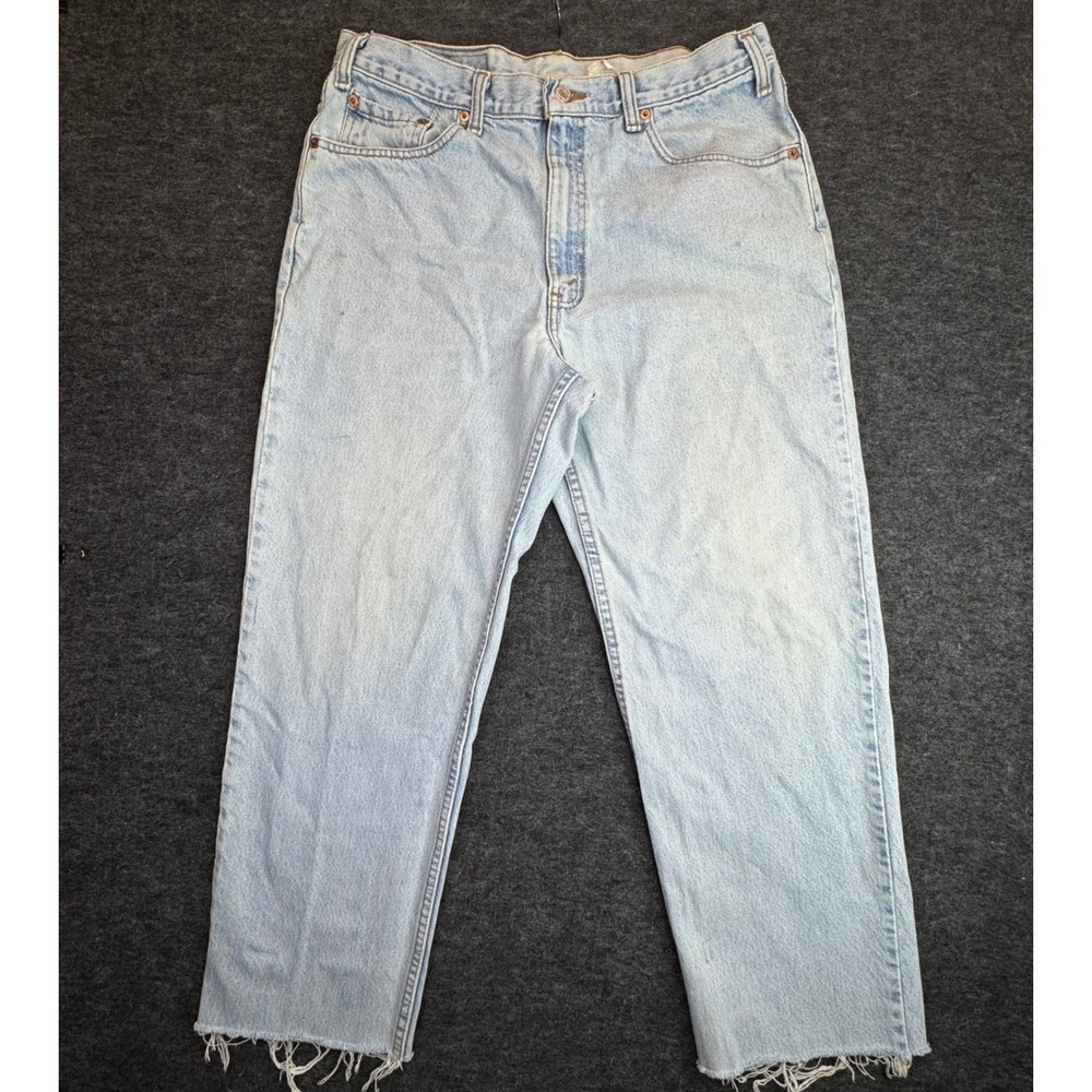 Vintage Levi's 550 Relaxed Fit Jeans Men Fit 34x27 Light Wash Blue Denim Raw Hem
